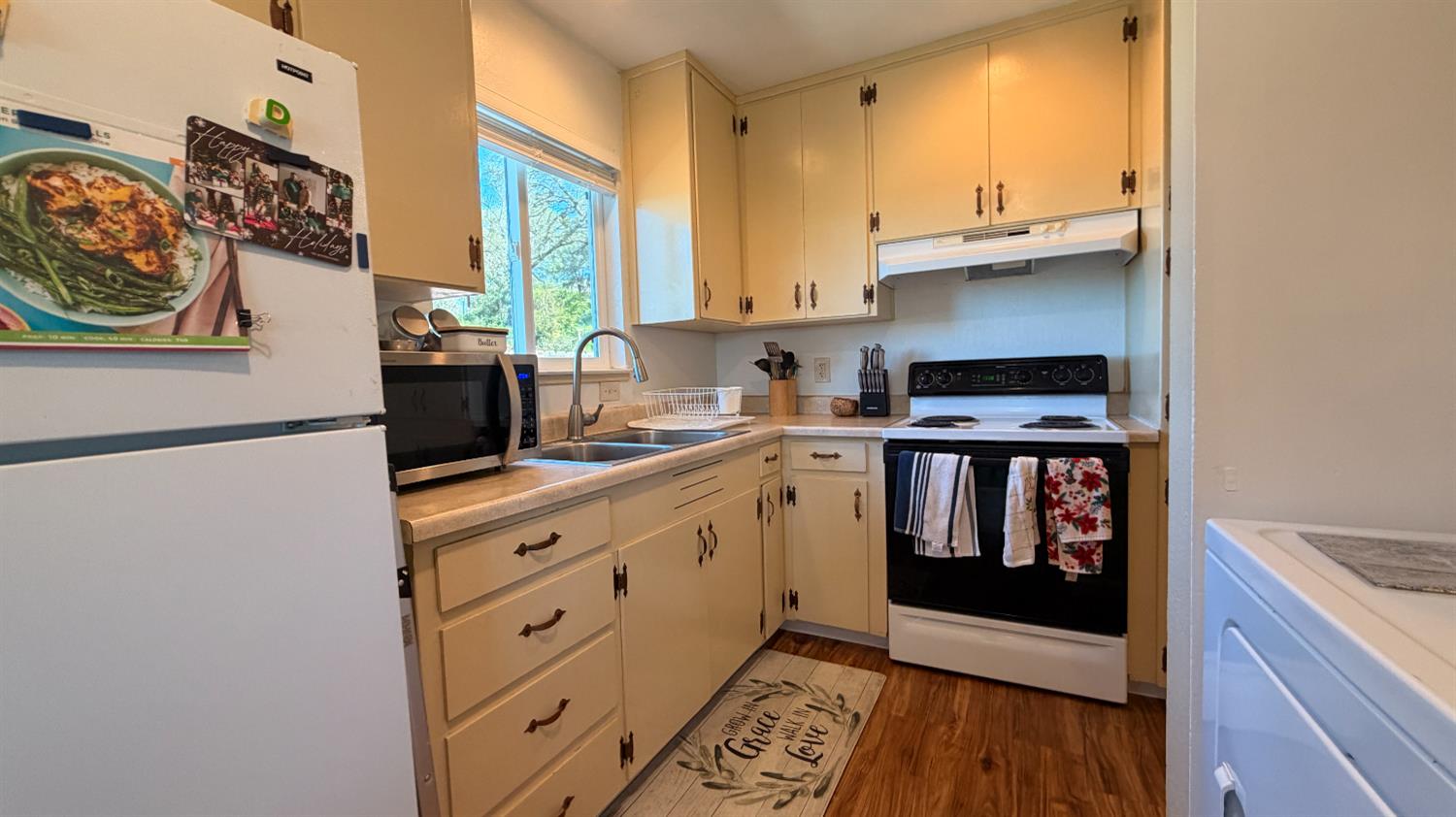 553 Russells Road San Andreas, CA 95249 - Photo 13 of 31 a kitchen with stainless steel appliances a stove a sink and a refrigerator