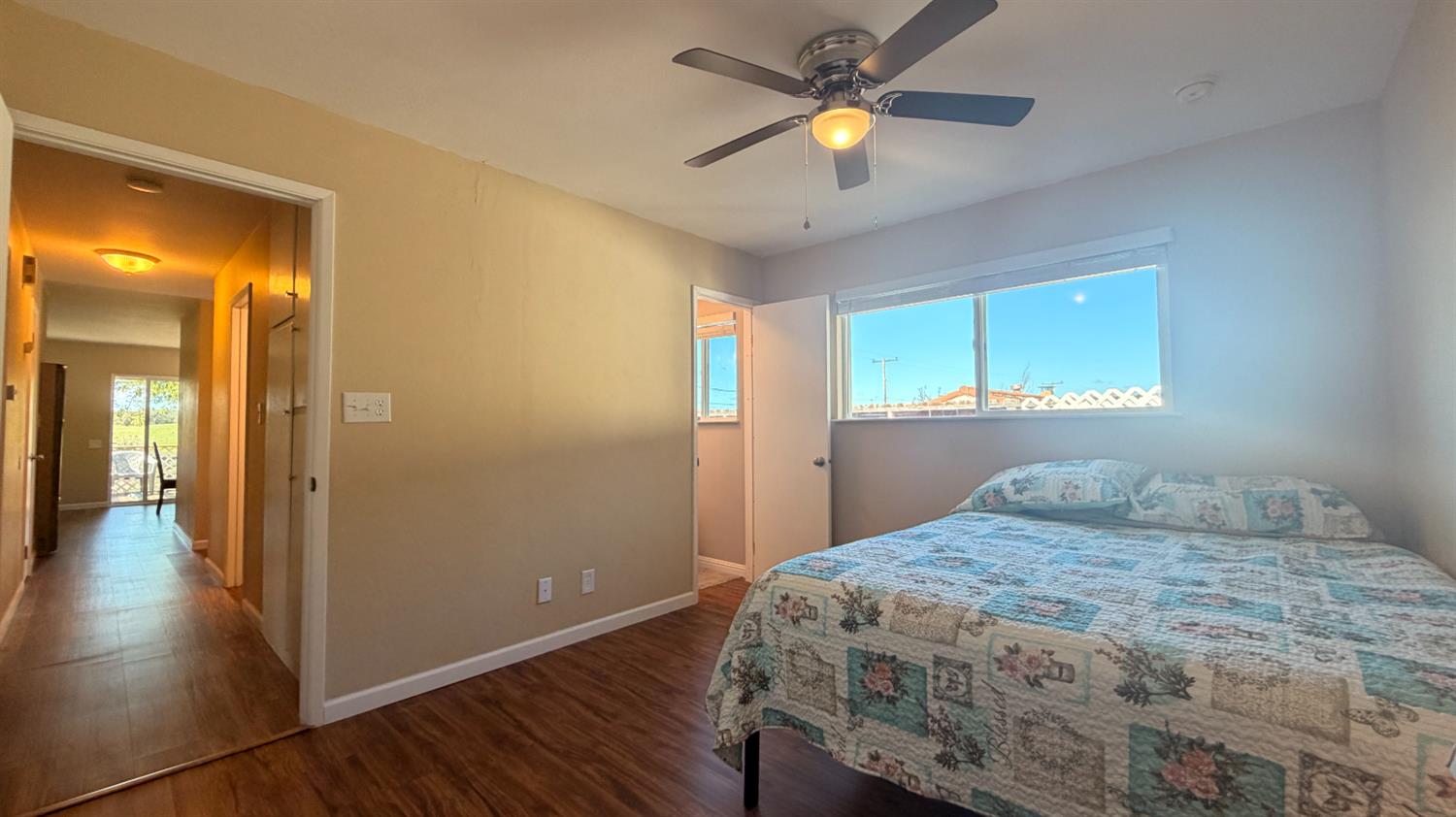 553 Russells Road San Andreas, CA 95249 - Photo 18 of 31 a bedroom with a bed and a chandelier