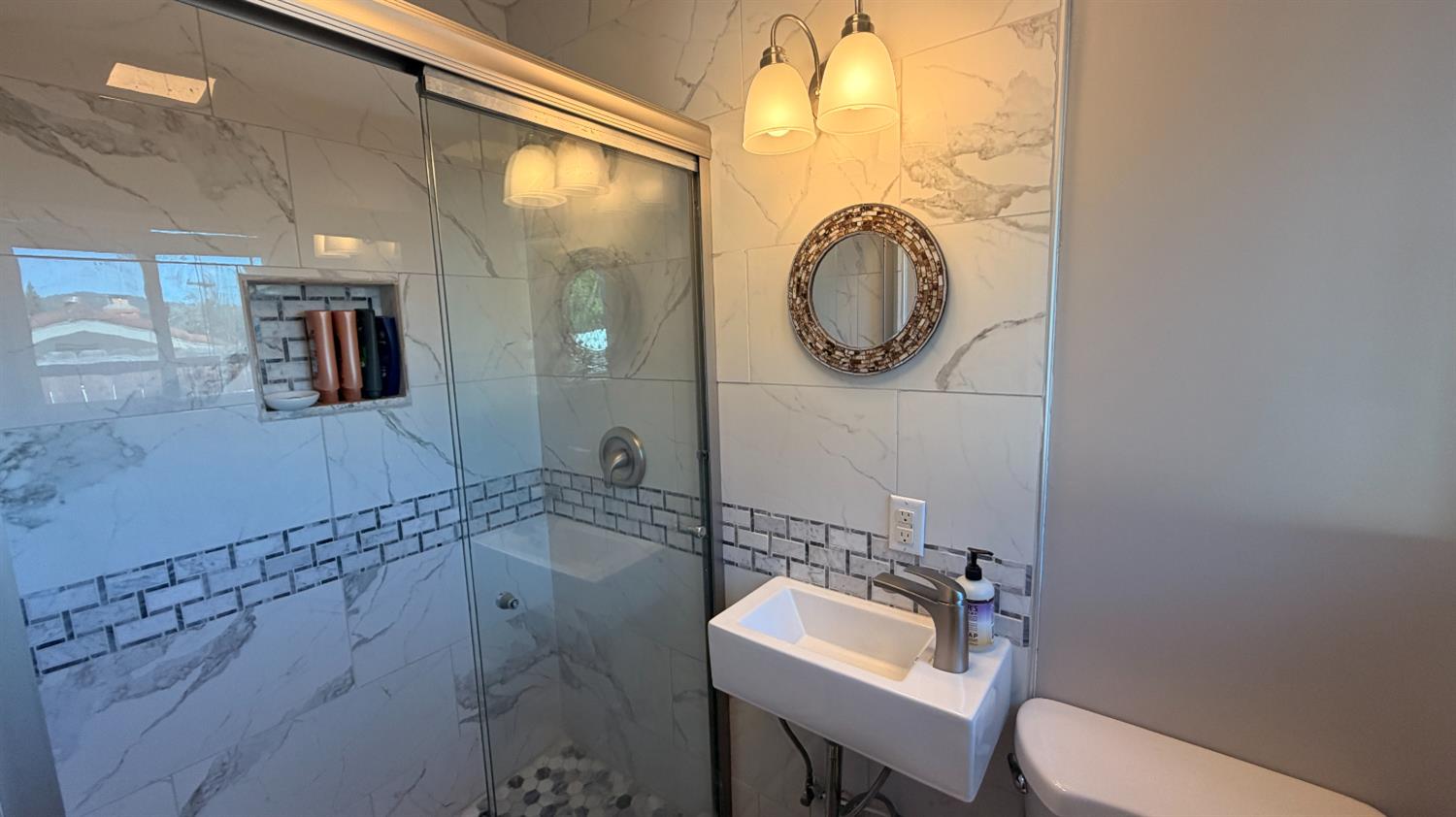 553 Russells Road San Andreas, CA 95249 - Photo 20 of 31 a bathroom with a toilet sink and mirror
