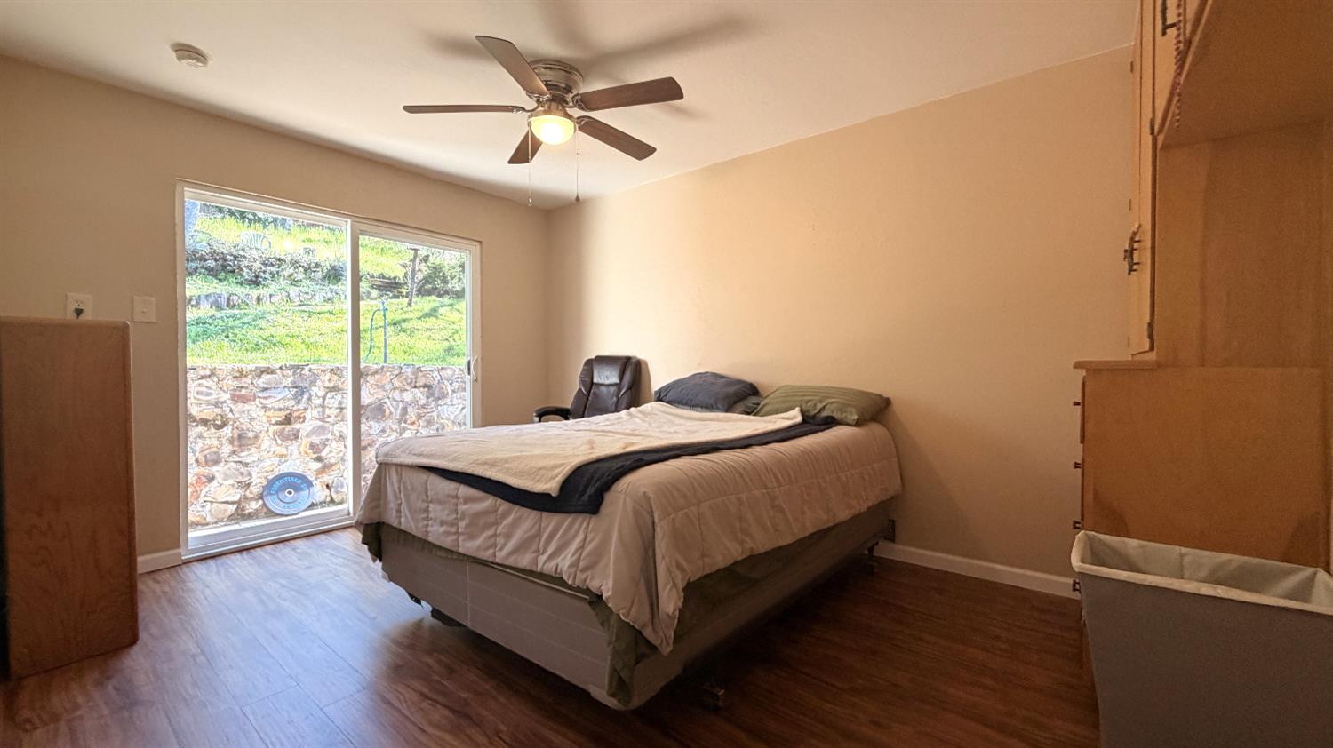 553 Russells Road San Andreas, CA 95249 - Photo 22 of 31 a bedroom with a bed and a large window