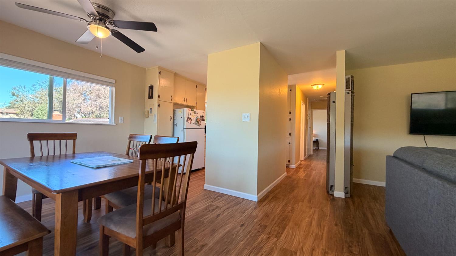 553 Russells Road San Andreas, CA 95249 - Photo 9 of 31 a view of a dining room with furniture window and wooden floor