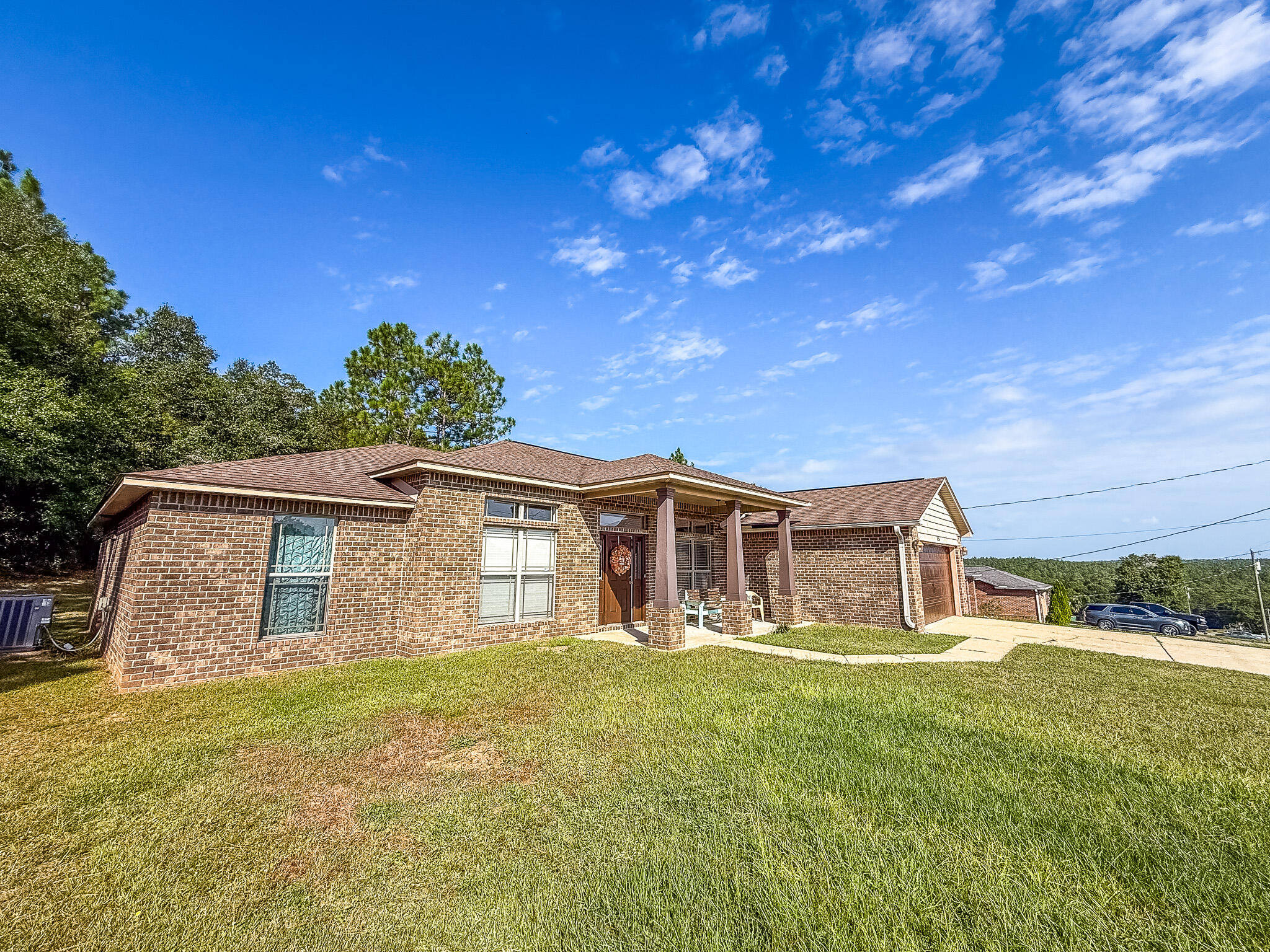 6214 Flash Lane Crestview, FL 32536 - Photo 2 of 42 a front view of a house with a yard