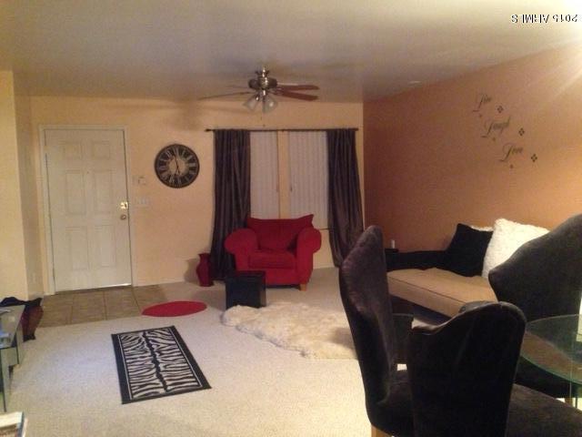 4134 West Vineyard Road Phoenix, AZ 85041 - Photo 4 of 7 a living room with furniture