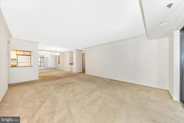 a view of a hallway with a chandelier
