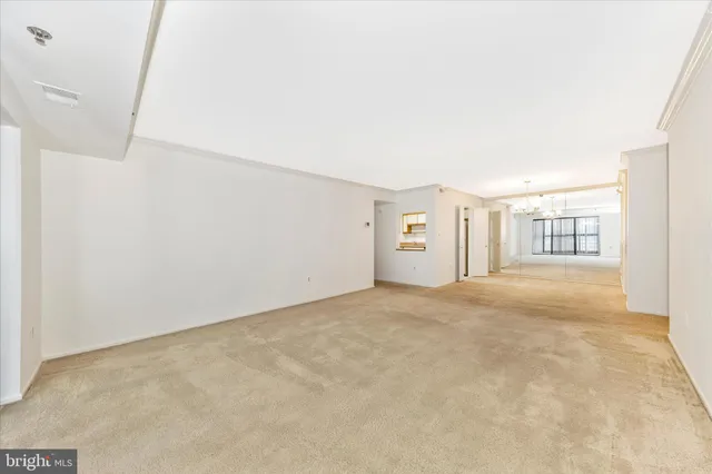 a view of a hallway with a chandelier