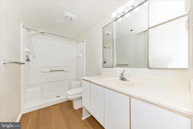 a view of a patio with dining table and chairs with wooden floor