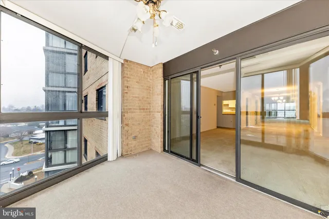 a view of a swimming pool with an outdoor seating and a yard
