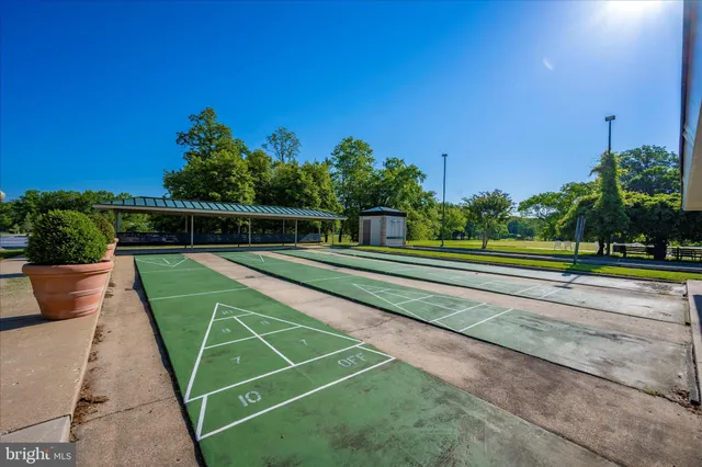 a view of a car park in front of a house