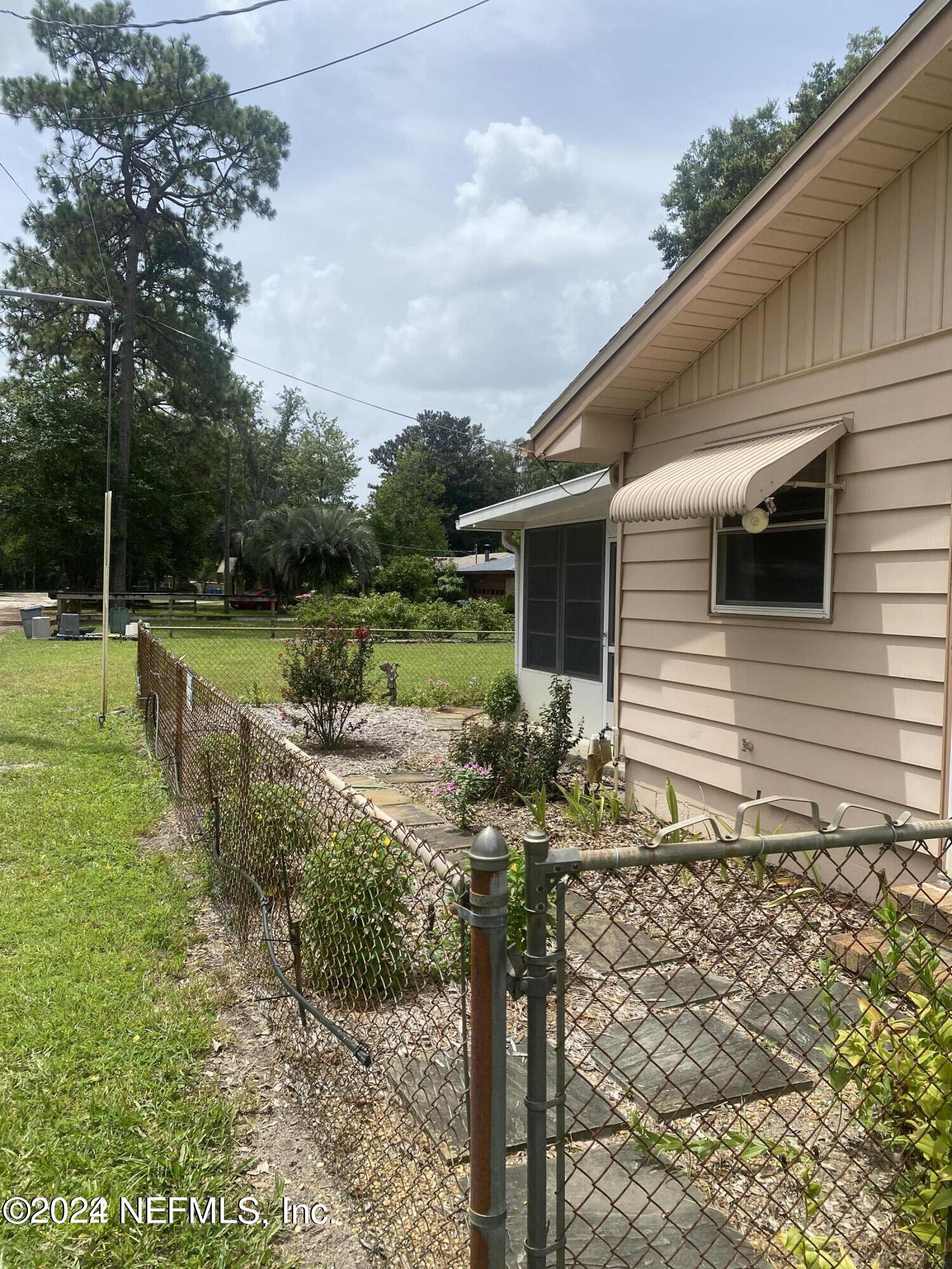 1328 Clements Road Jacksonville, FL 32211 - Photo 12 of 17 a front view of a house with garden