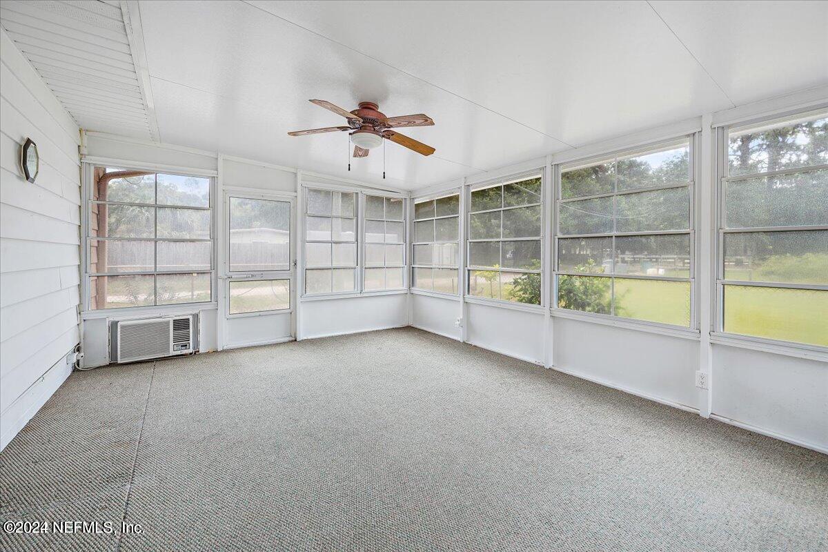 1328 Clements Road Jacksonville, FL 32211 - Photo 16 of 17 an empty room with windows and ceiling fan