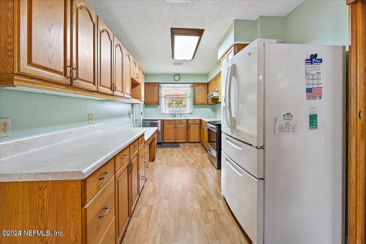 1328 Clements Road Jacksonville, FL 32211 - Photo 2 of 17 a white refrigerator freezer sitting inside of a kitchen