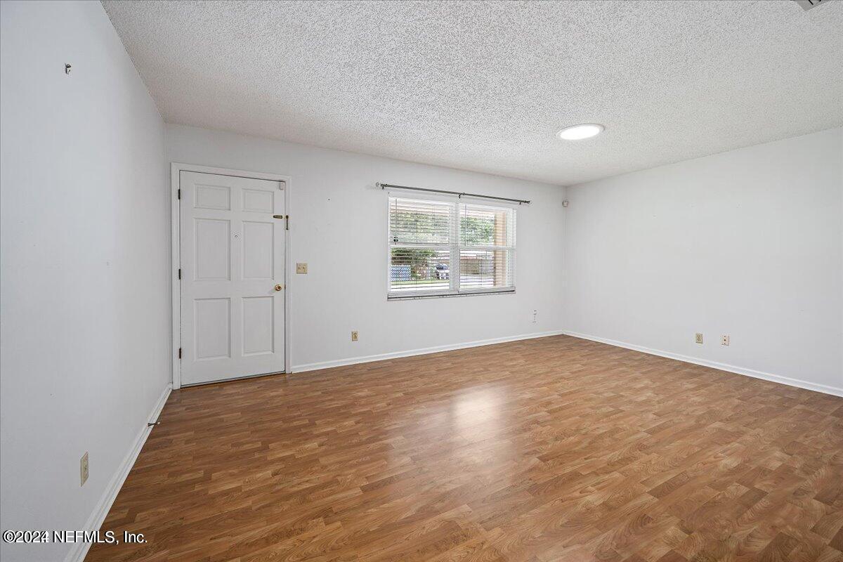 1328 Clements Road Jacksonville, FL 32211 - Photo 4 of 17 an empty room with a window