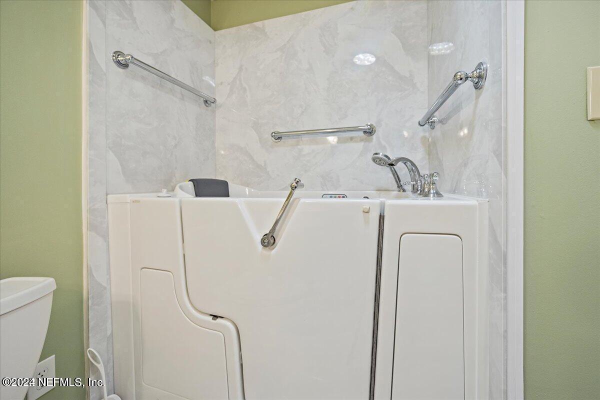 1328 Clements Road Jacksonville, FL 32211 - Photo 7 of 17 a bathroom with a shower and a shower