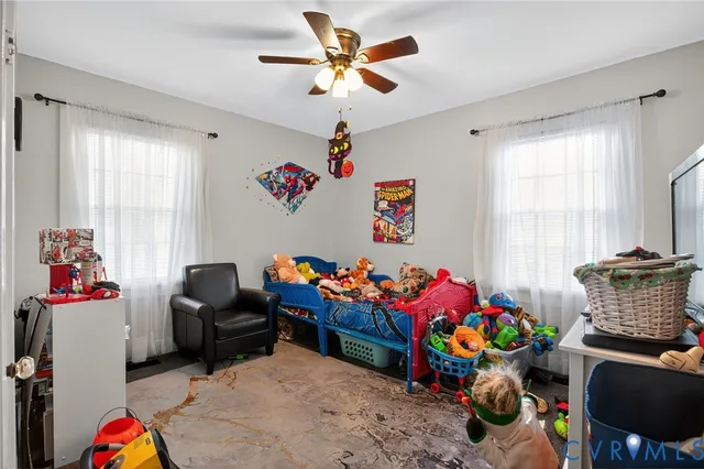 a play room with toys and a couch