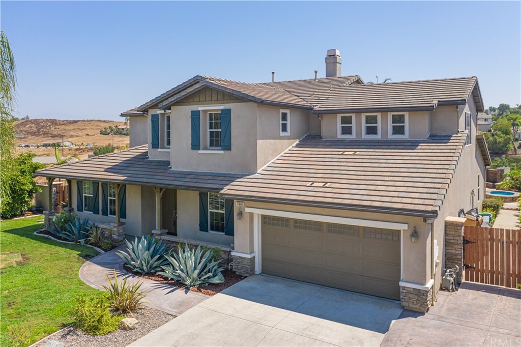 17006 Hidden Trails Lane Riverside, CA 92503 - Photo 1 of 1 a front view of a house with a yard