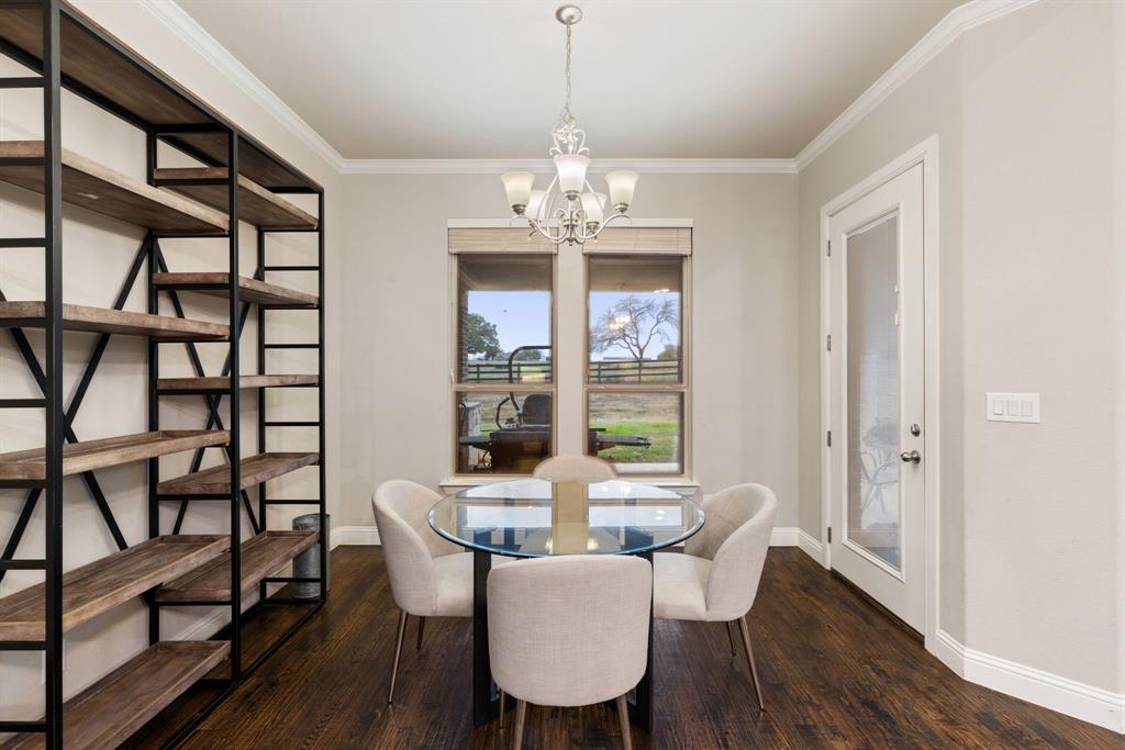 251 Hlavek Road Decatur, TX 76234 - Photo 18 of 33 a view of a dining room with furniture a chandelier and wooden floor