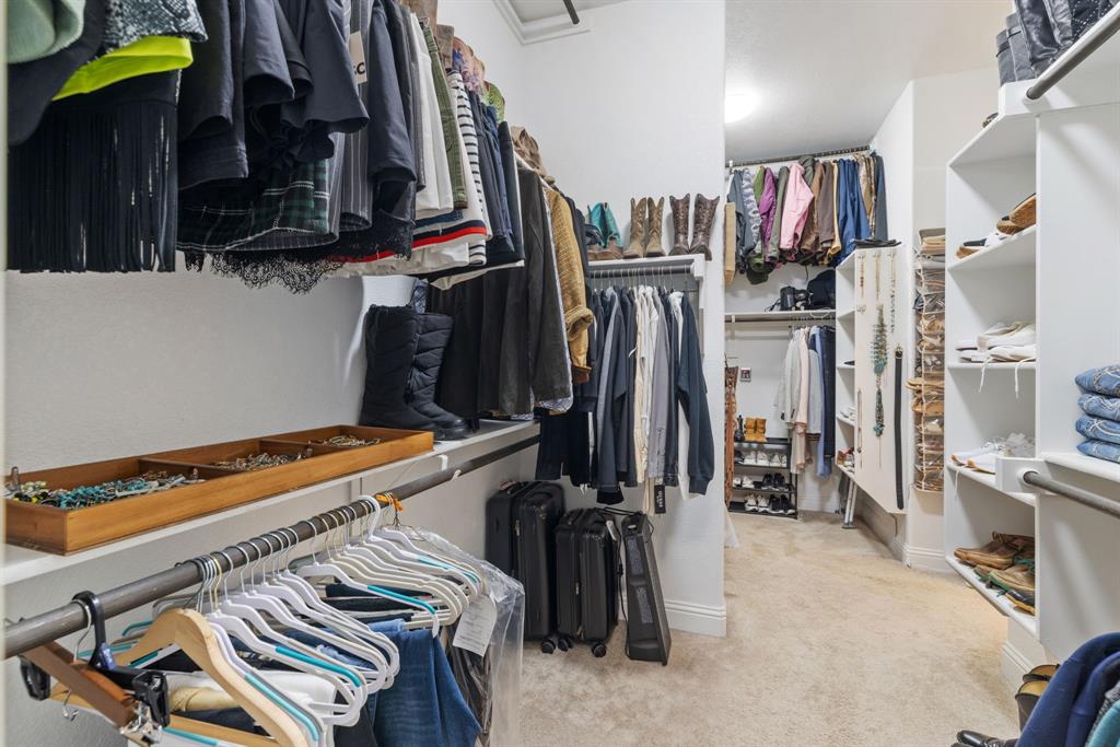 251 Hlavek Road Decatur, TX 76234 - Photo 24 of 33 a view of walk in closet with clothes and shoes