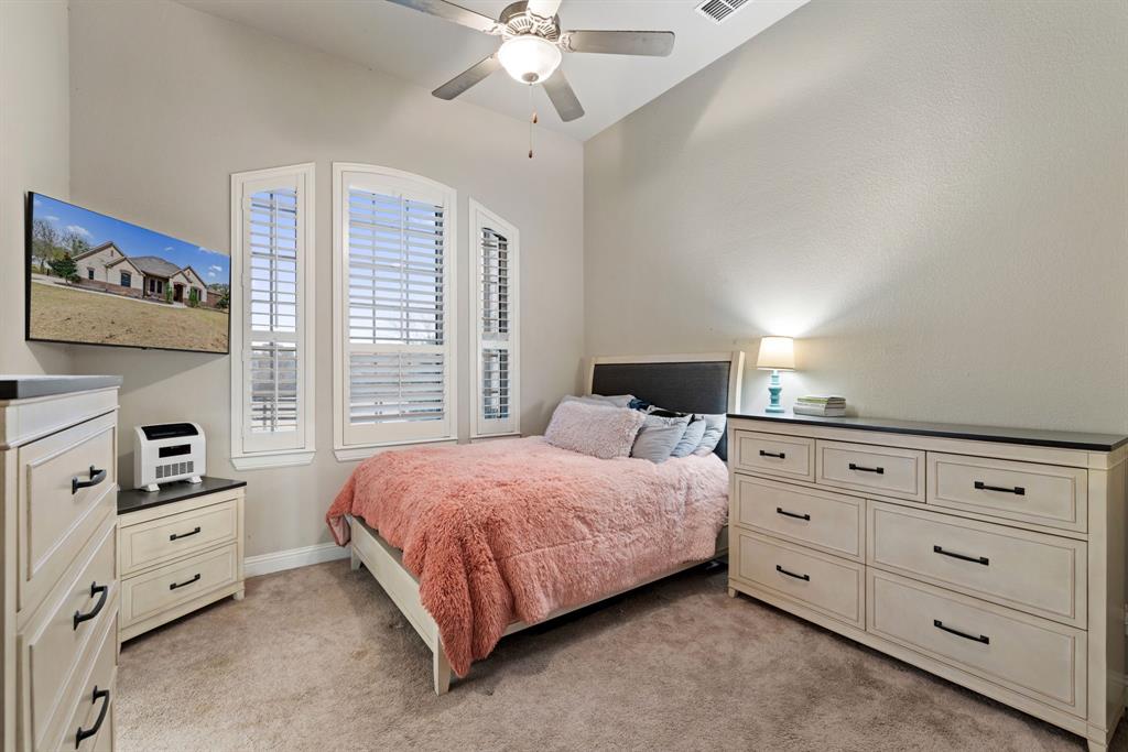 251 Hlavek Road Decatur, TX 76234 - Photo 25 of 33 a bedroom with a bed and a dresser