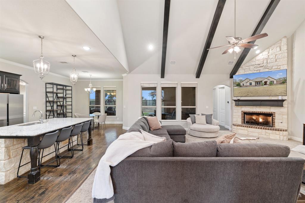 251 Hlavek Road Decatur, TX 76234 - Photo 10 of 33 a living room with furniture a fireplace and a floor to ceiling window