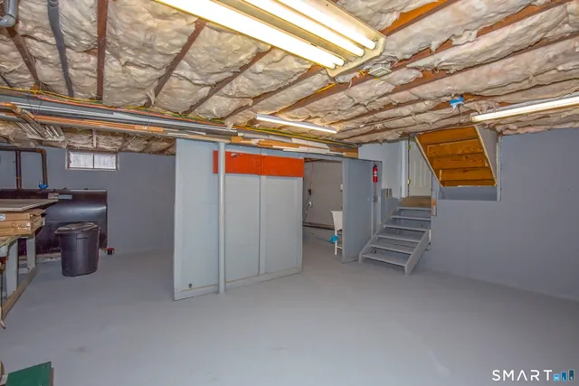 a view of storage and utility room with stairs