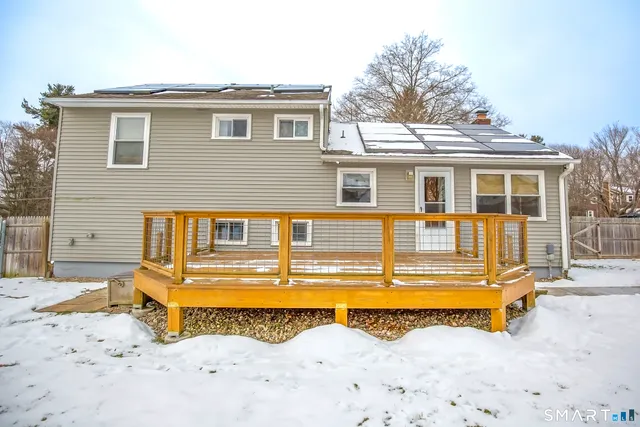 a view of a house with a yard covered in the house