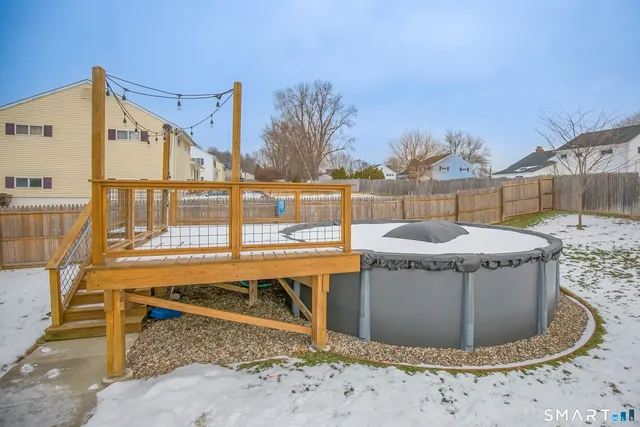 a view of a backyard with swimming pool