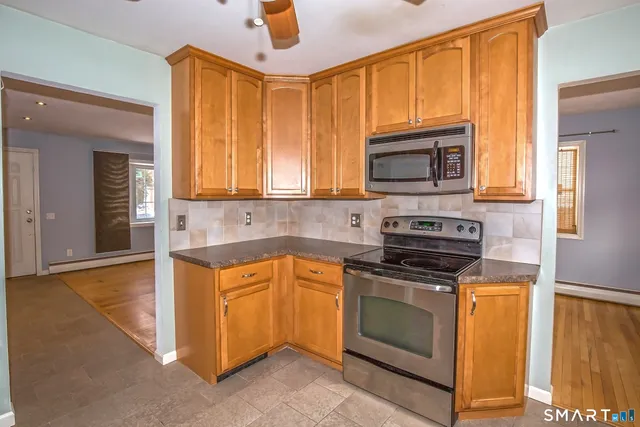 a kitchen with a stove and a microwave