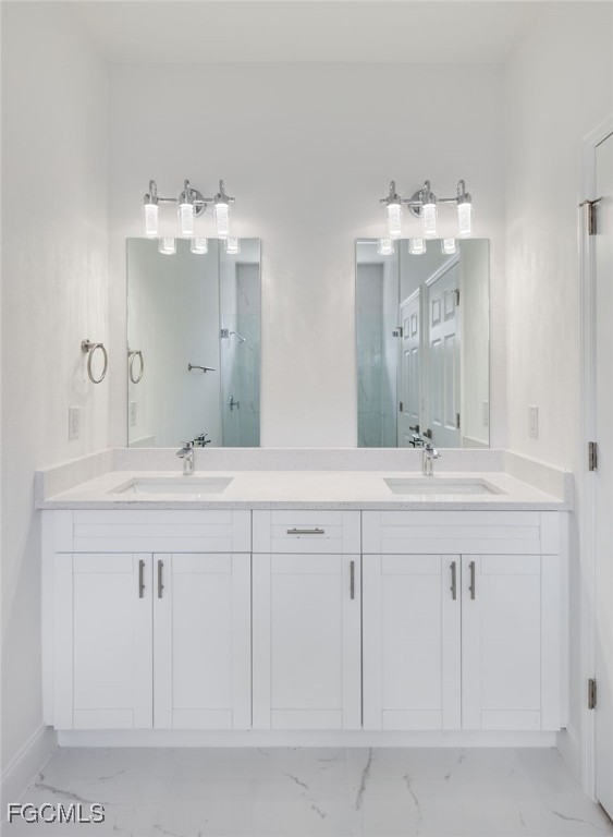 3216 13th Street Southwest Lehigh Acres, FL 33976 - Photo 14 of 23 a bathroom with double sink and a mirror