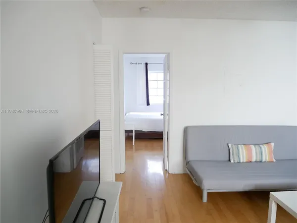 a view of a livingroom with furniture and wooden floor