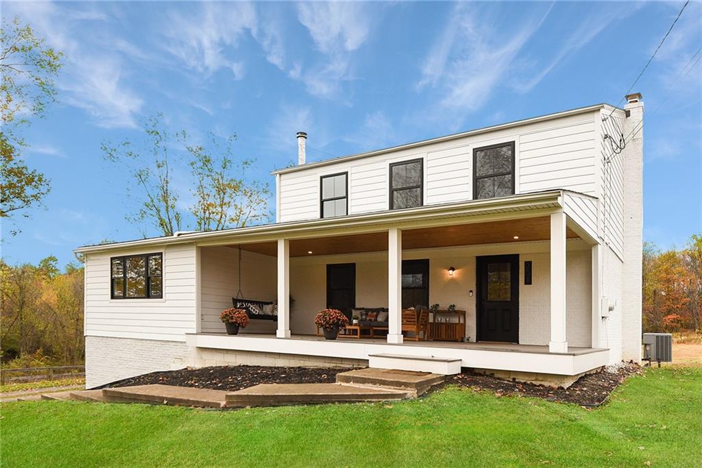 front view of a house with a yard