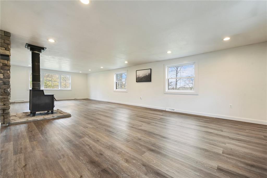 201 Joe Cain Road Bulger, PA 15019 - Photo 19 of 49 a view of an empty room with wooden floor and a window