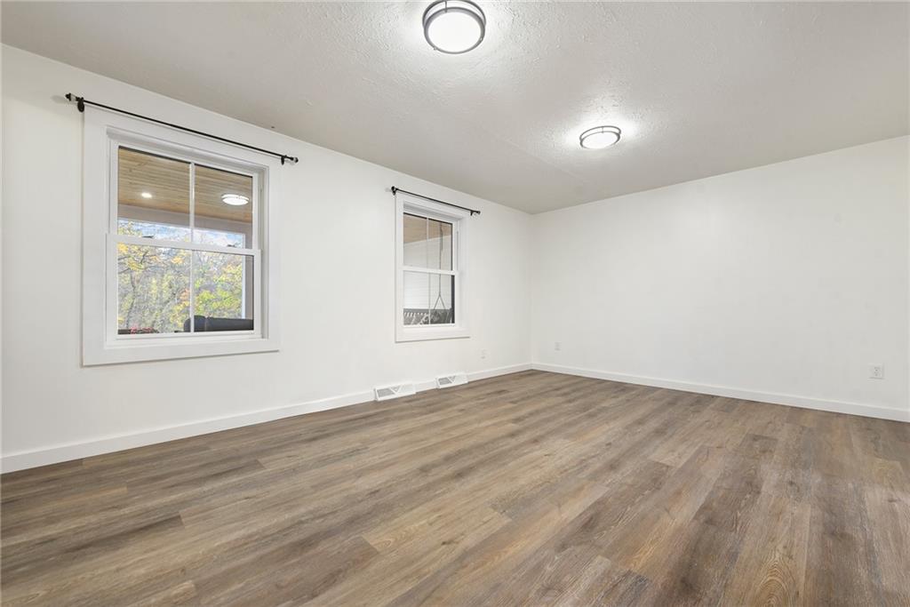201 Joe Cain Road Bulger, PA 15019 - Photo 25 of 49 a view of empty room with wooden floor and fan