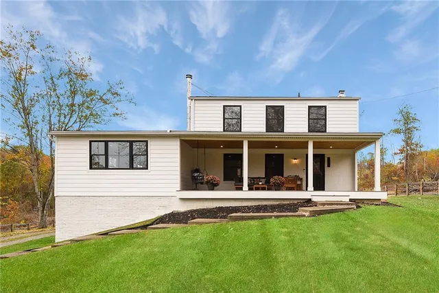 front view of a house with a yard