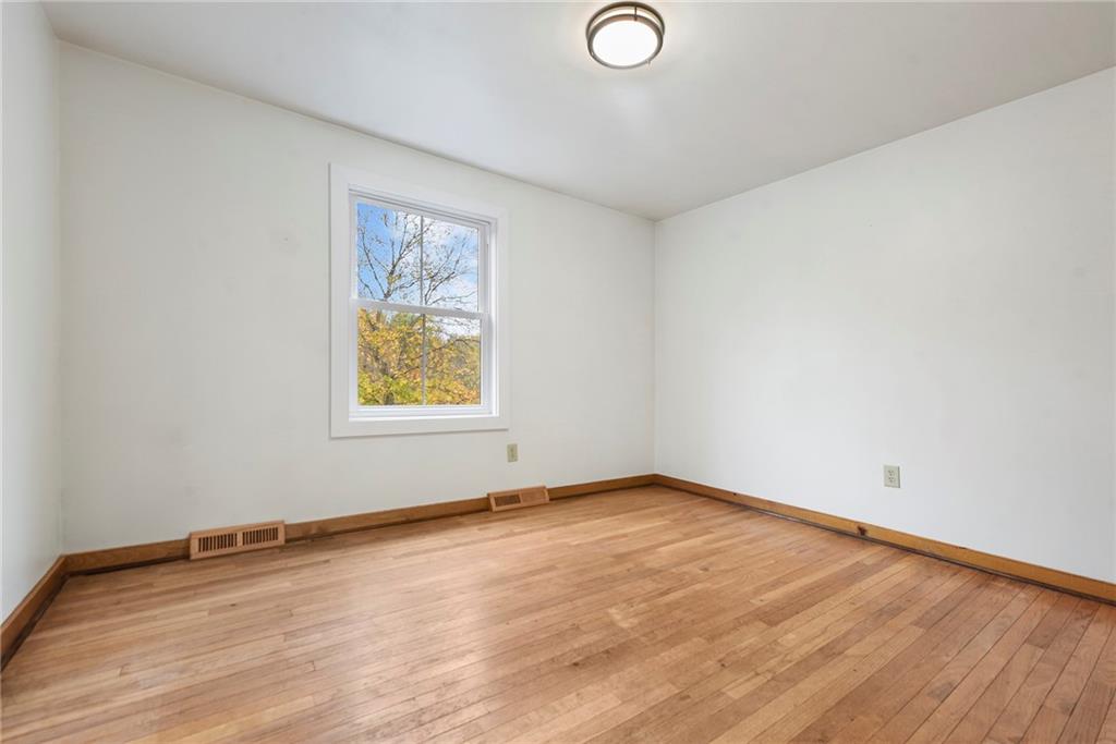201 Joe Cain Road Bulger, PA 15019 - Photo 38 of 49 an empty room with wooden floor and windows
