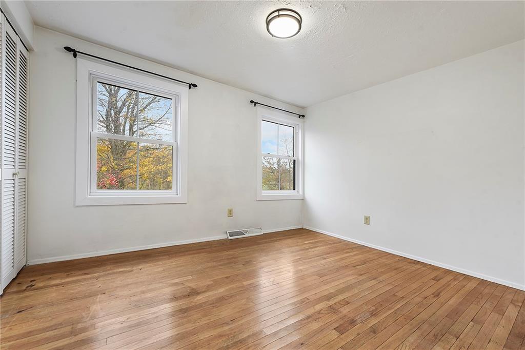 201 Joe Cain Road Bulger, PA 15019 - Photo 40 of 49 an empty room with wooden floor and windows