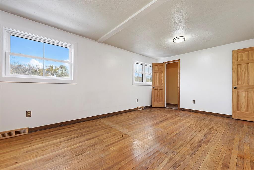 201 Joe Cain Road Bulger, PA 15019 - Photo 42 of 49 a view of an empty room with wooden floor and a window
