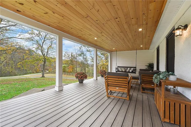 a outdoor space with wooden floor and windows