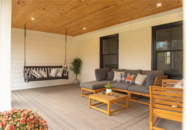 a living room with couch and wooden floor
