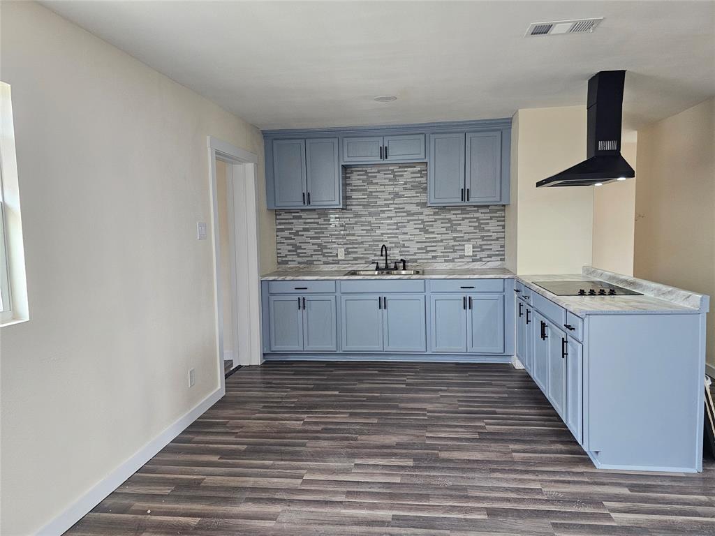 a kitchen with stainless steel appliances granite countertop a sink and cabinets