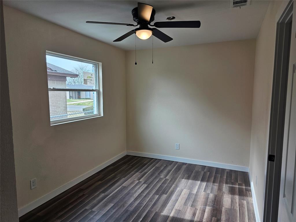 4317 Gram Lane Bellmead, TX 76705 - Photo 24 of 34 a view of room with window and hardwood floor