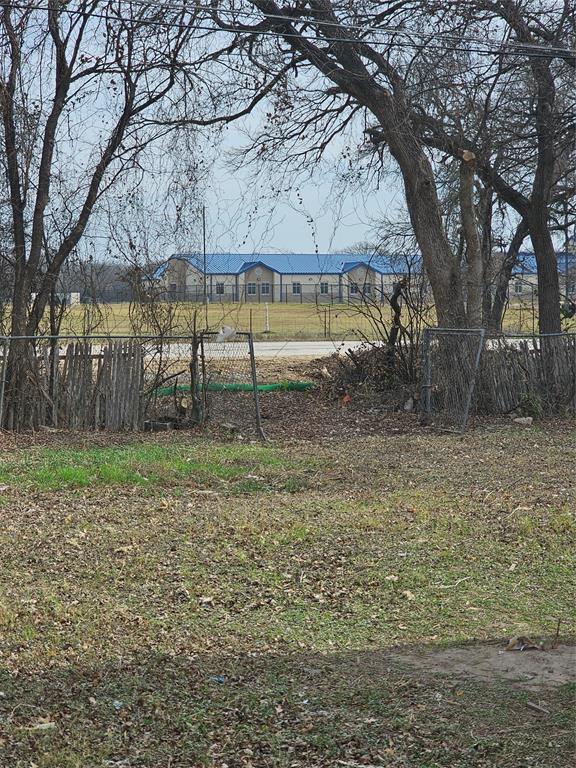 4317 Gram Lane Bellmead, TX 76705 - Photo 26 of 34 a view of backyard with tree
