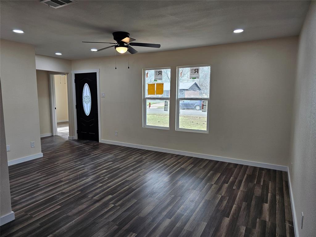 4317 Gram Lane Bellmead, TX 76705 - Photo 3 of 34 wooden floor in an empty room with a window