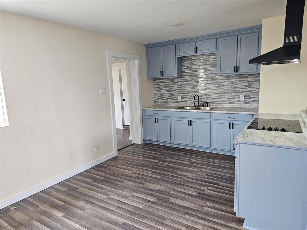 4317 Gram Lane Bellmead, TX 76705 - Photo 31 of 34 a kitchen with granite countertop a sink and cabinets