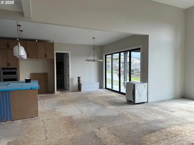 a view of a kitchen with furniture and a window