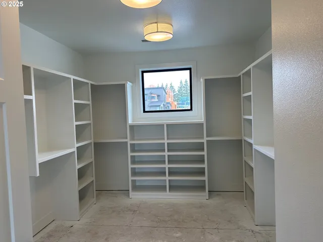 a view of an empty room and a window