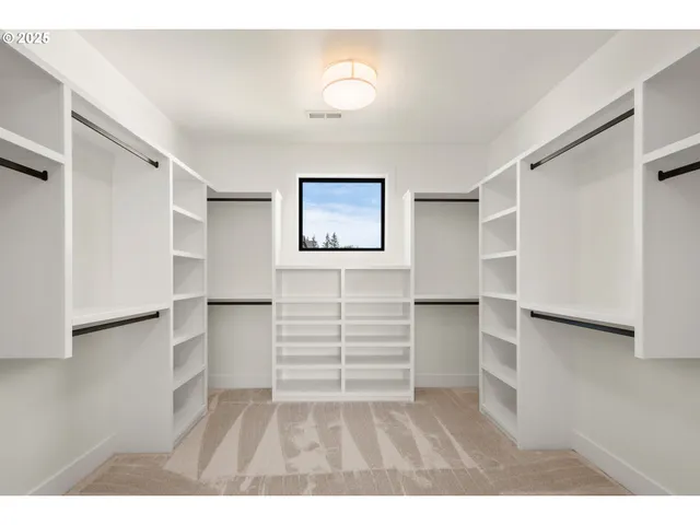 a kitchen with cabinets and stainless steel appliances