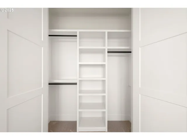 a view of an empty room with potted plant