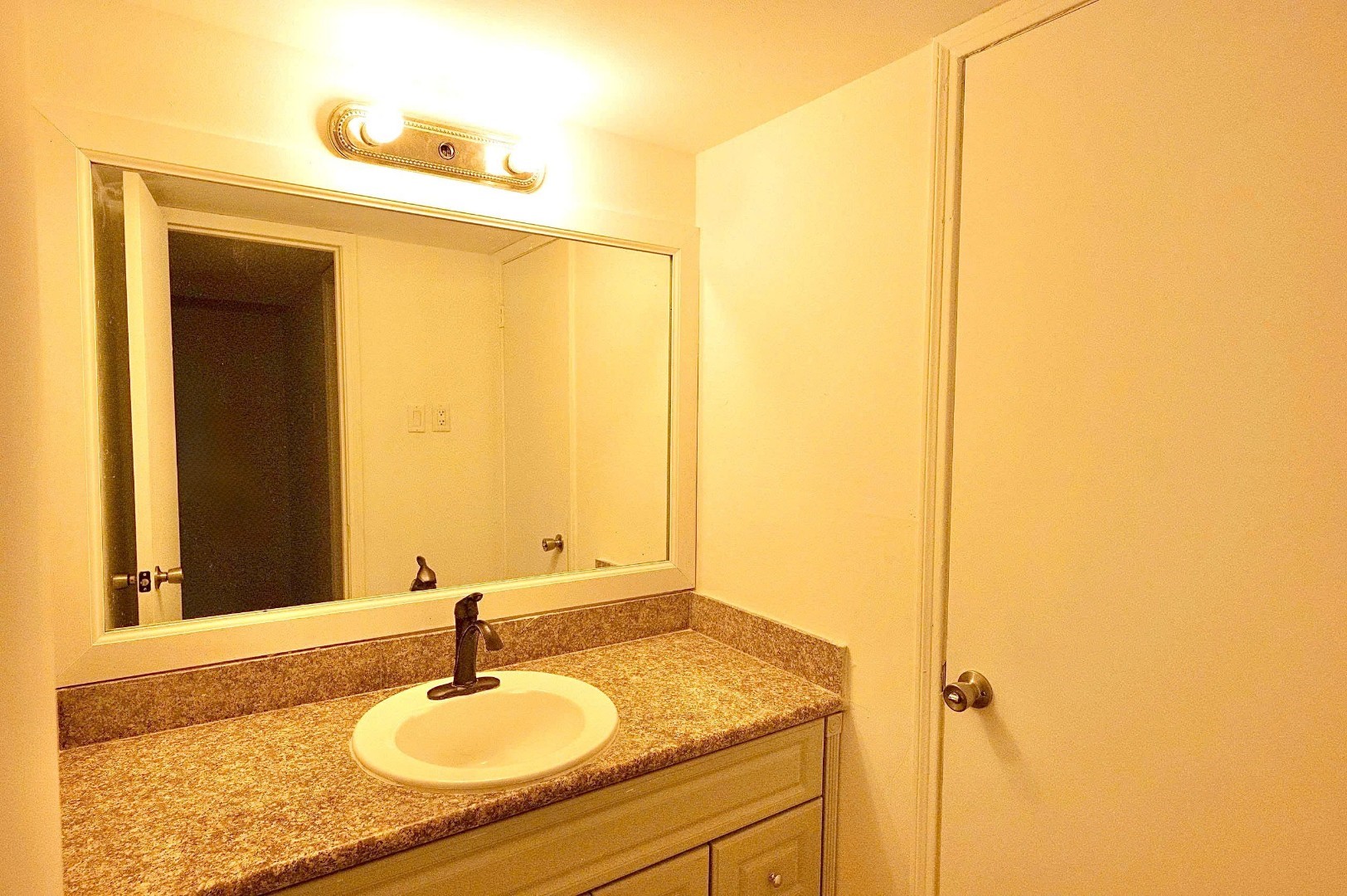 12048 Beechnut Street Houston, TX 77072 - Photo 12 of 21 a bathroom with a sink and a mirror