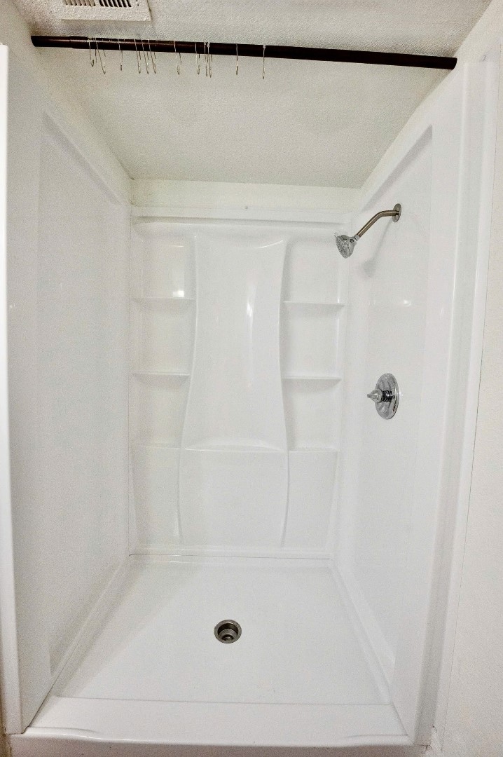 12048 Beechnut Street Houston, TX 77072 - Photo 14 of 21 a bathroom with a shower