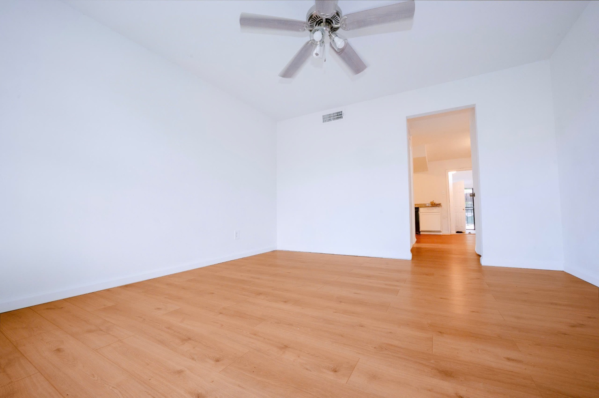 12048 Beechnut Street Houston, TX 77072 - Photo 3 of 21 a view of empty room with wooden floor